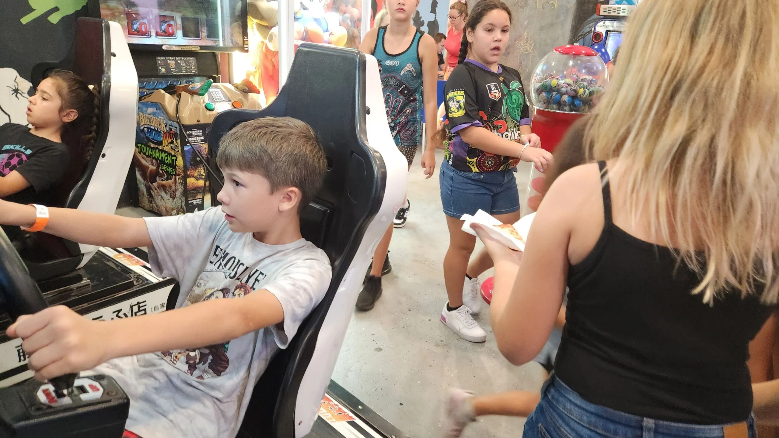 intense group of kids playing arcades
